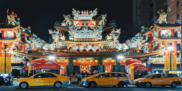 Traditional Taiwanese temple illuminated at night in Taipei showcasing taiwan visa entry requirements travel destination attractions Caption Description