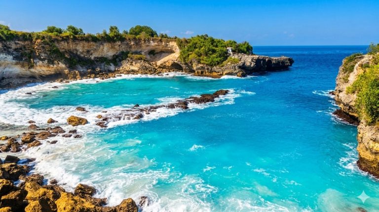 Turquoise water and rocky limestone coastline at Blue Lagoon Beach in East Bali Caption: Description: