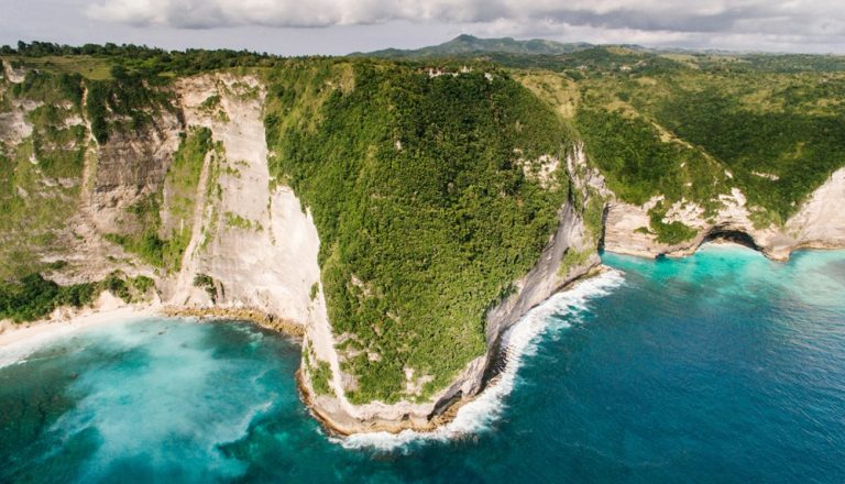 Bali belly travel guide featuring the coastline and cliffs of Nusa Penida near Bali Indonesia