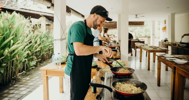 Food in Bali cooking class where travelers learn to prepare traditional Balinese dishes using local ingredients and authentic techniques Caption Description