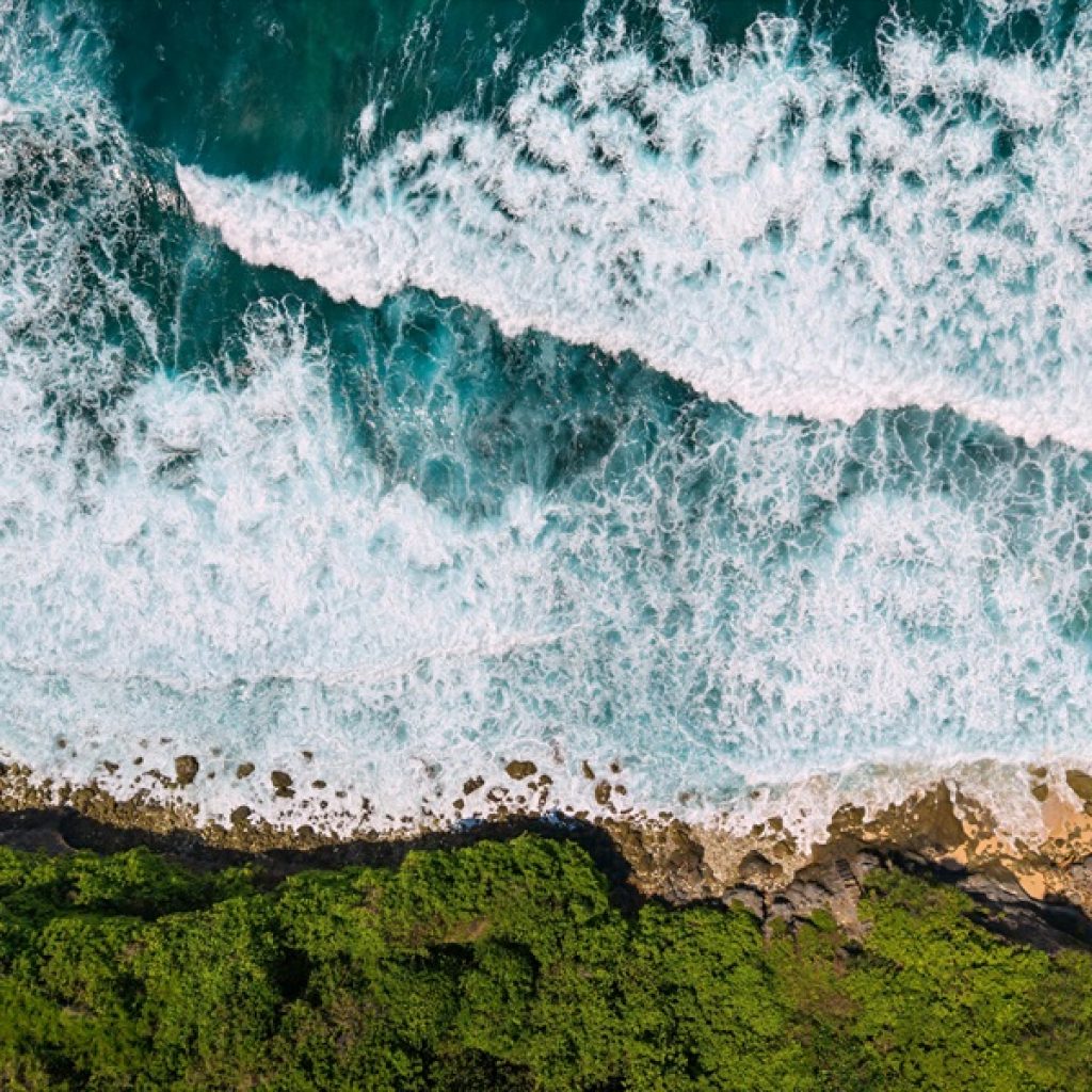 Day trips from Bali featuring dramatic coastline views and turquoise waters along Bali's southern shore