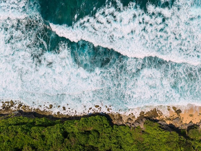 Day trips from Bali featuring dramatic coastline views and turquoise waters along Bali's southern shore