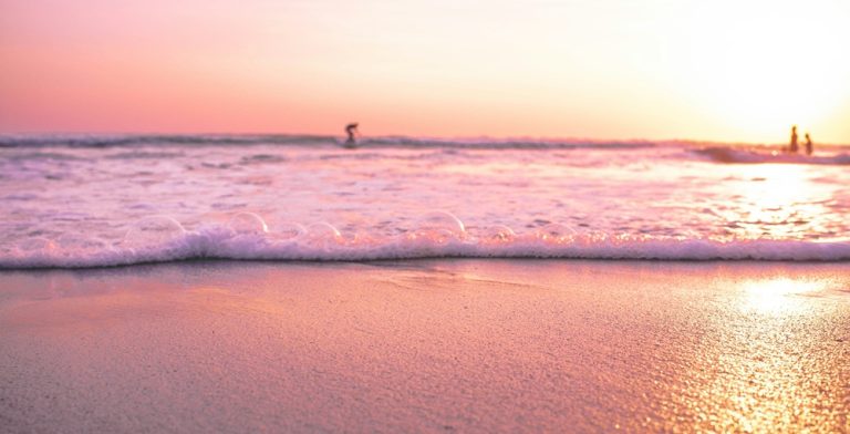 Seminyak travel guide featuring a colorful sunset over Double Six Beach in Seminyak, Bali