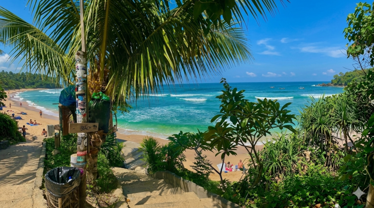 Tropical scenery and turquoise water at Nyang Nyang Beach featured in this Uluwatu travel guide Caption: Description: