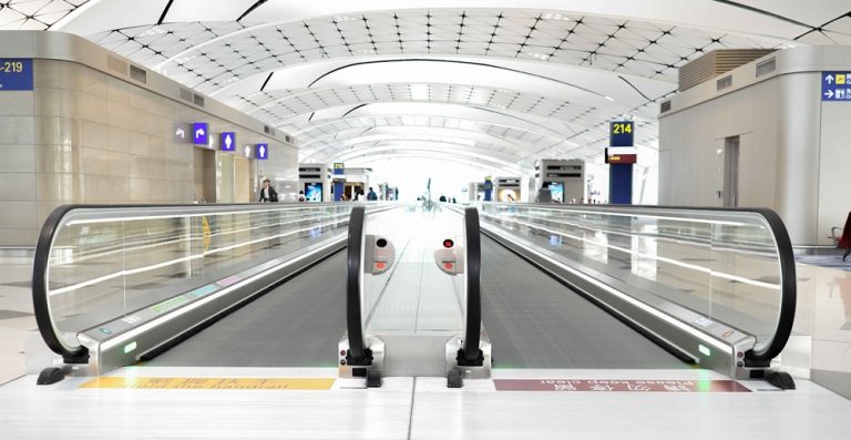 Bali airport guide showing the modern terminal walkway inside Ngurah Rai International Airport