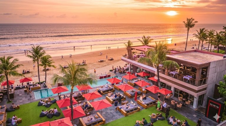 Visitors enjoying sunset views at KU DE TA beach club overlooking Seminyak Beach in Bali