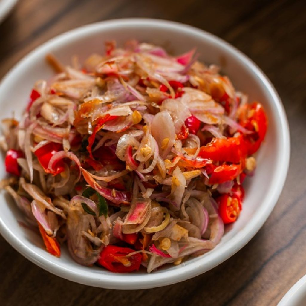 Food in Bali featuring Sambal Matah made with shallots, chili peppers, lemongrass, and traditional Balinese spices