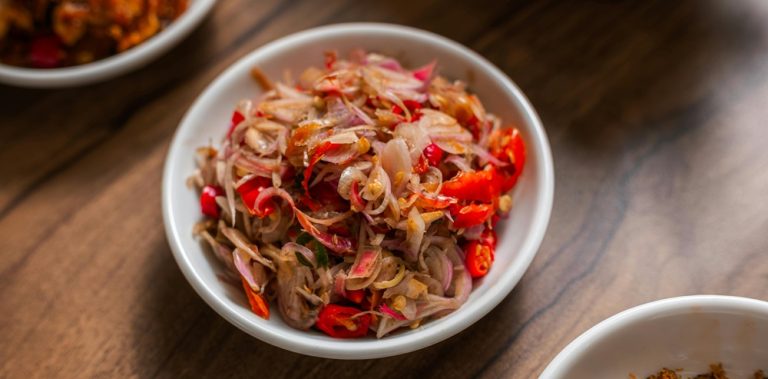 Food in Bali featuring Sambal Matah made with shallots, chili peppers, lemongrass, and traditional Balinese spices