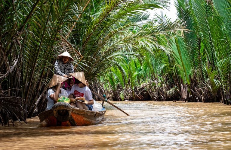 Traditional boat tour through the Mekong Delta, one of the best things to do in Vietnam