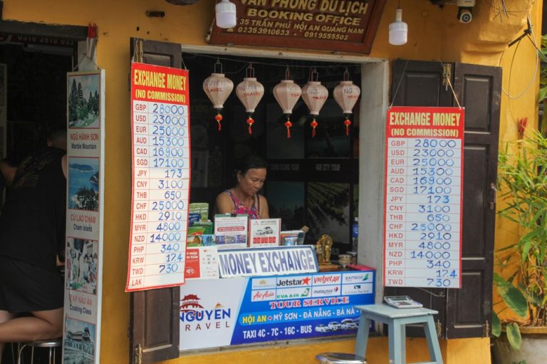 Currency exchange office in Vietnam displaying foreign exchange rates for international travellers Caption Description