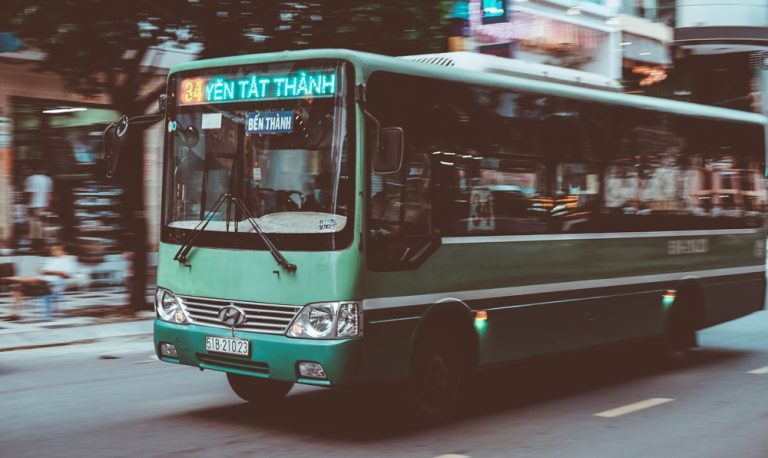 Public bus travelling through Ho Chi Minh City, Vietnam, one of the many transportation options for getting around Vietnam Caption Description