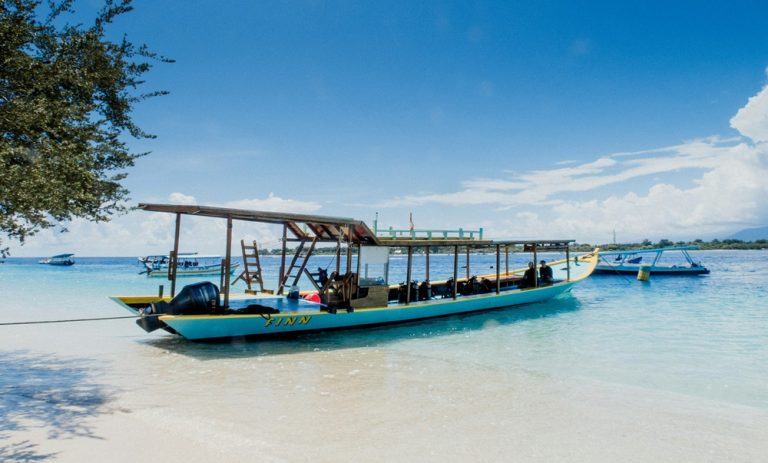 Traditional boat on the beach featured in this Gili Islands travel guide, showing one of the most popular ways to travel between Bali, Lombok and the Gili Islands.