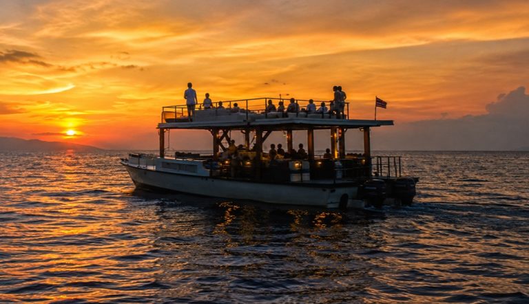 Luxury sunset cruise featured in this Gili Islands travel guide, sailing through the turquoise waters of the Gili Islands at golden hour. Caption Description