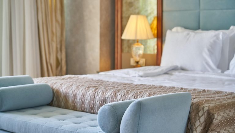Kuta Lombok Travel Guide: Comfortable hotel room with a king-size bed, modern furnishings and stylish interior, representing accommodation in Kuta Lombok.