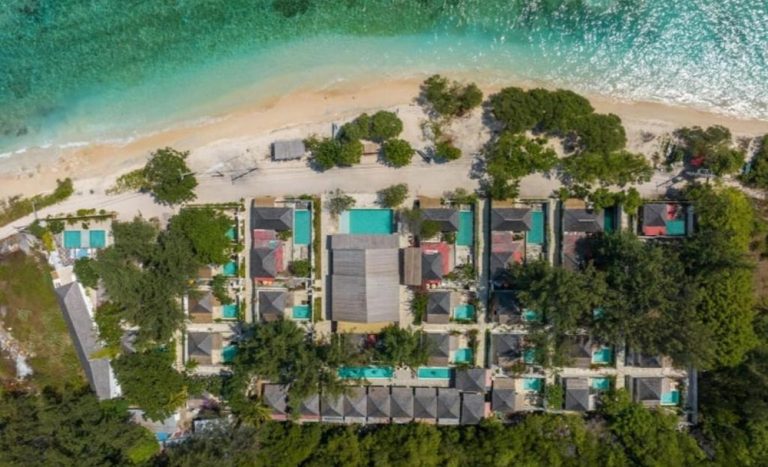 Aerial view of Ora Resort Gili Meno featuring beachfront villas, private pools and crystal-clear turquoise water.