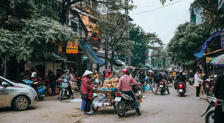 Busy street market in Hanoi, one of the best things to do in Vietnam Caption Description