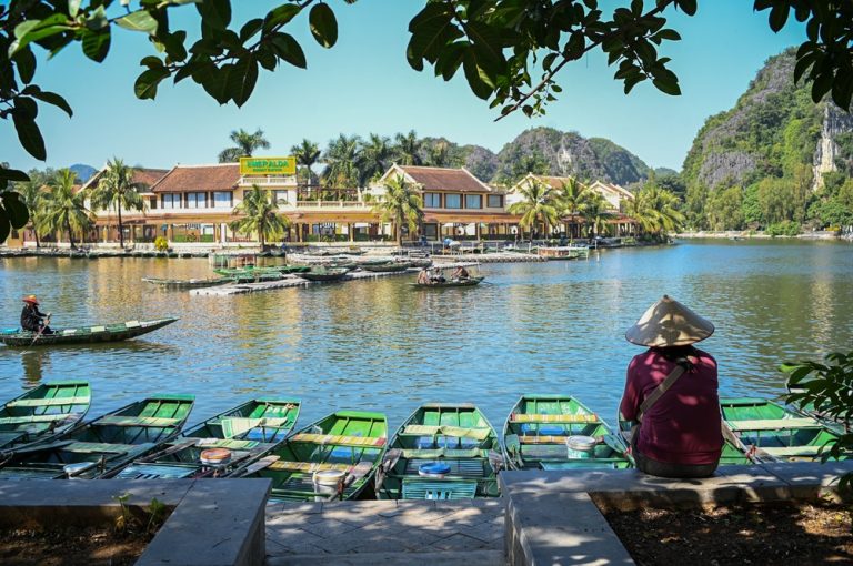 Traditional rowing boats on the river at Tràng An Scenic Landscape Complex in Ninh Bình, Vietnam
