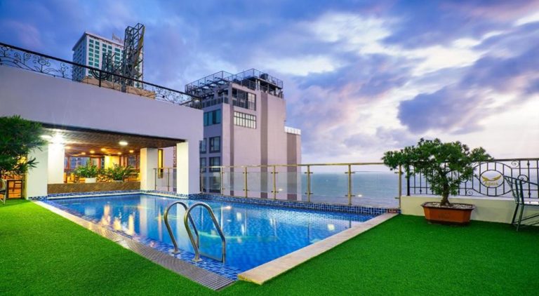 Rooftop swimming pool at Apus Hotel Nha Trang with panoramic views of the coastline and city