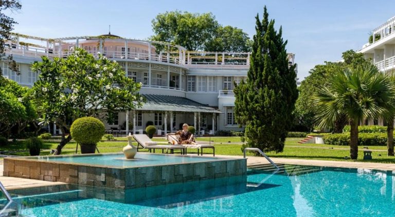 Swimming pool and elegant colonial architecture at Azerai La Residence, Hue, one of the city's finest luxury hotels