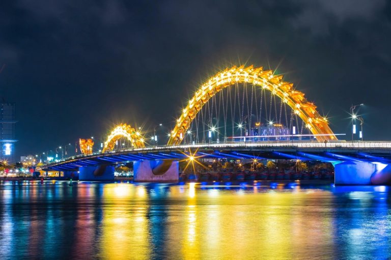Things to do in Da Nang - illuminated Dragon Bridge over the Han River at night