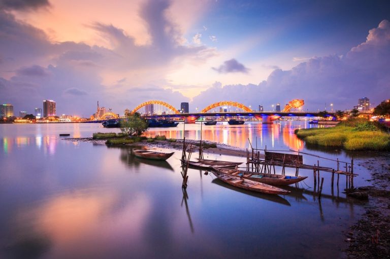 Illuminated Dragon Bridge spanning the Han River in Da Nang at sunset Caption: Description: