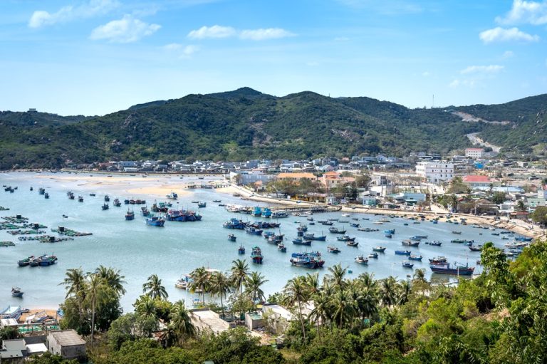 Vietnam Itinerary: Colourful fishing boats anchored in the harbour of Con Dao, Southern Vietnam