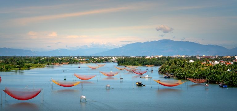 Traditional fishing nets on the Thu Bon River near Hoi An, one of the unique places to visit in Vietnam Caption Description
