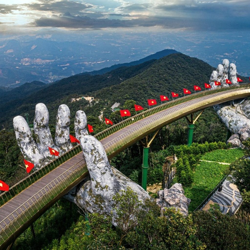 Things to do in Da Nang - Golden Bridge at Ba Na Hills held by giant stone hands