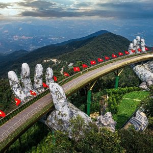 Things to do in Da Nang - Golden Bridge at Ba Na Hills held by giant stone hands