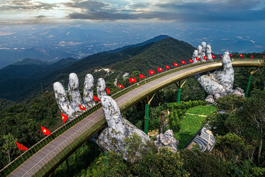 Things to do in Da Nang - Golden Bridge at Ba Na Hills held by giant stone hands
