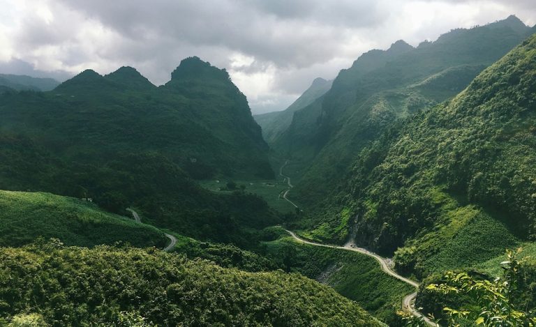 Mountain roads winding through the Ha Giang Loop during the best time to visit Vietnam Caption Description
