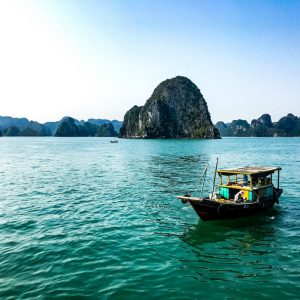 Traditional fishing boat on the emerald waters of Ha Long Bay, one of the highlights during the best time to visit Vietnam