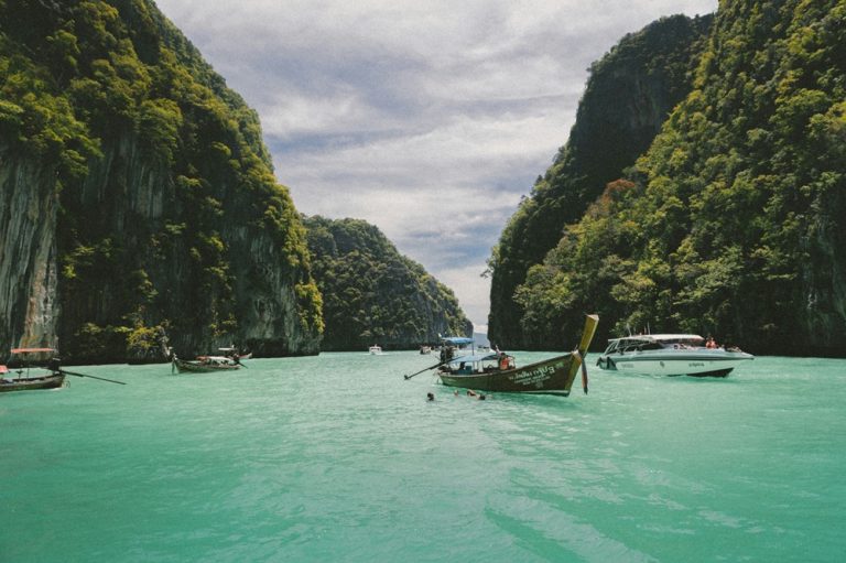 Traditional boats sailing through Ha Long Bay during the best time to visit Vietnam