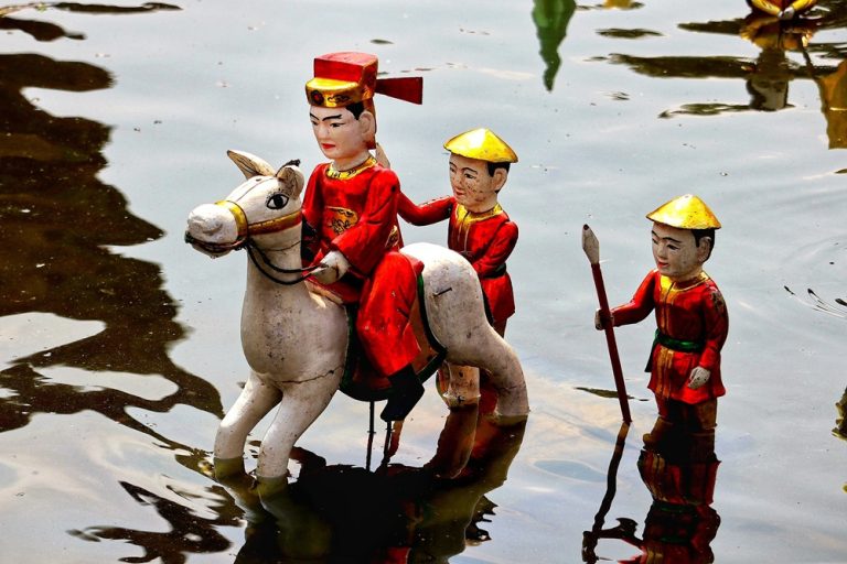 Traditional Vietnamese water puppets performing on the water in Hanoi