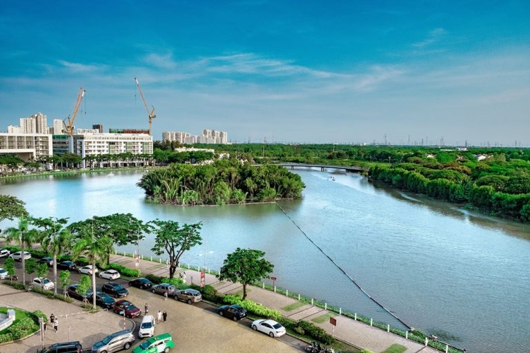 Things to do in Ho Chi Minh - riverside landscape with green spaces and modern development