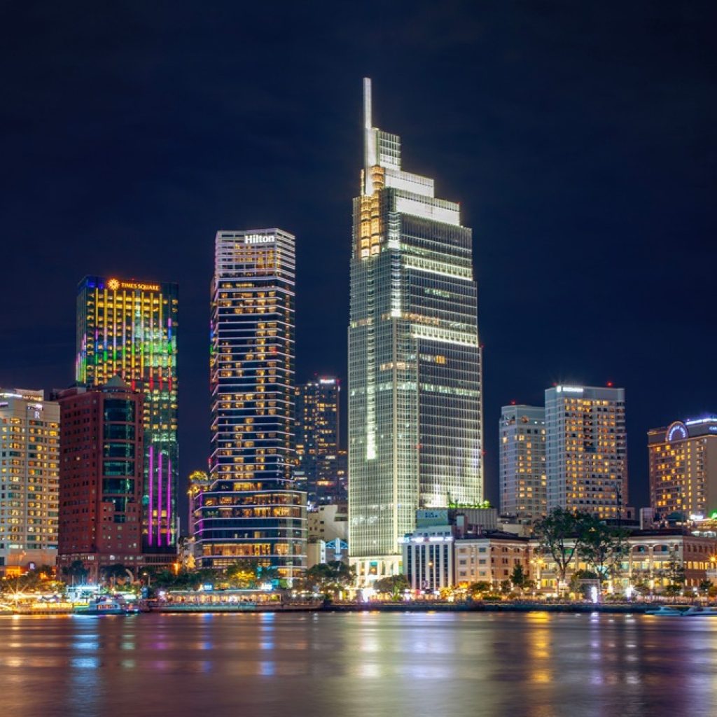 Things to do in Ho Chi Minh - illuminated city skyline along the Saigon River at night