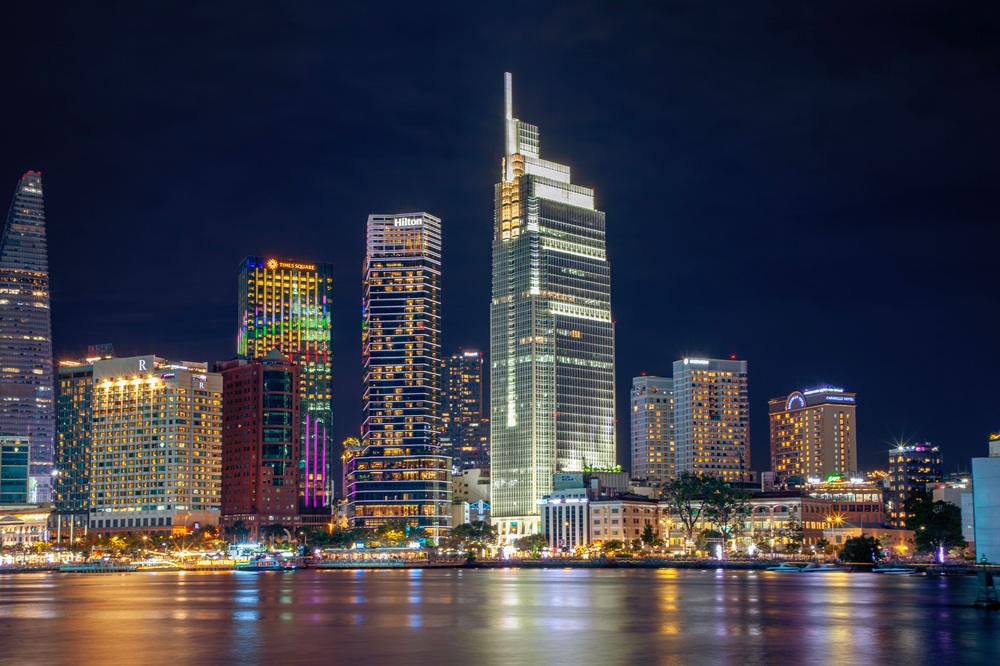 Things to do in Ho Chi Minh - illuminated city skyline along the Saigon River at night