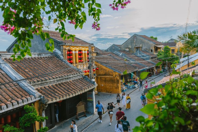 Rooftop view of Hoi An Ancient Town with traditional yellow buildings and red lanterns