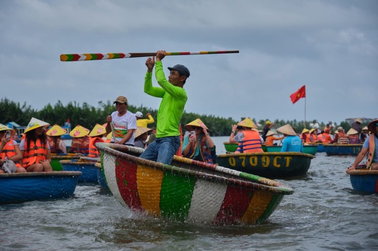Things to do in Hoi An include taking a traditional basket boat ride through the waterways near Cam Thanh Coconut Village. Caption Description