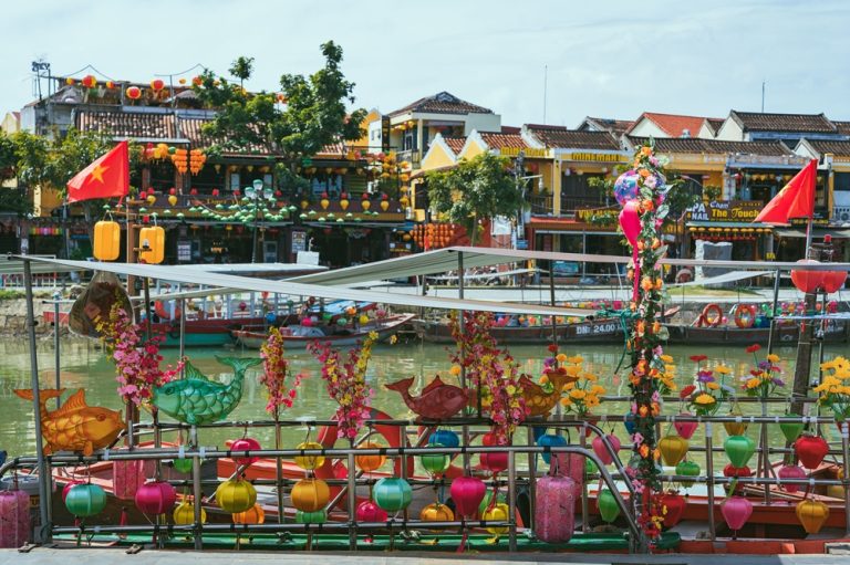 Colorful lantern-decorated boats along the river in central Hoi An.