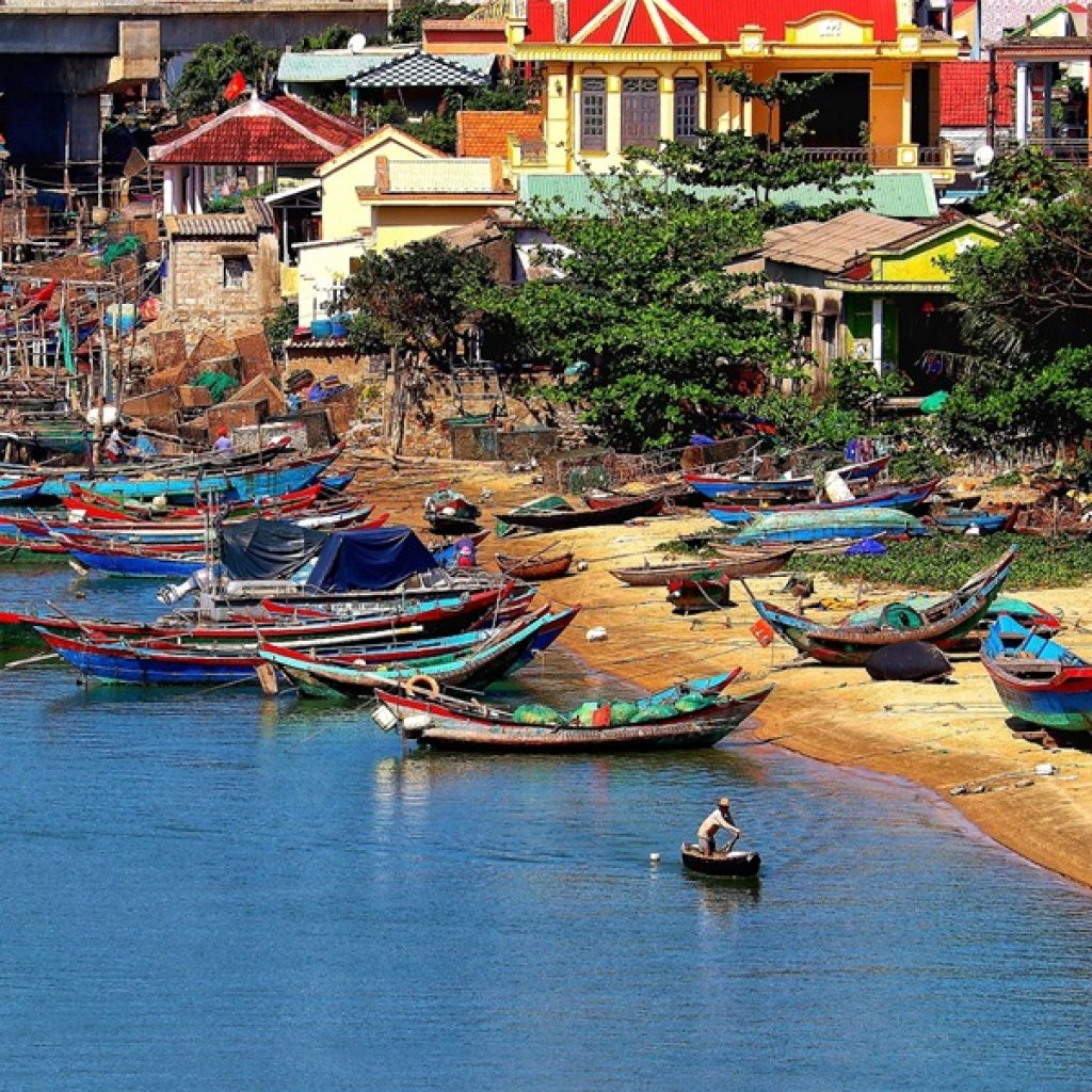 Things to do in Hoi An include exploring the colourful riverside and traditional fishing boats along the waterfront.