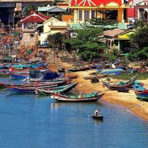 Things to do in Hoi An include exploring the colourful riverside and traditional fishing boats along the waterfront.