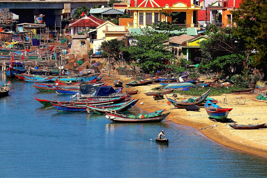 Things to do in Hoi An include exploring the colourful riverside and traditional fishing boats along the waterfront.