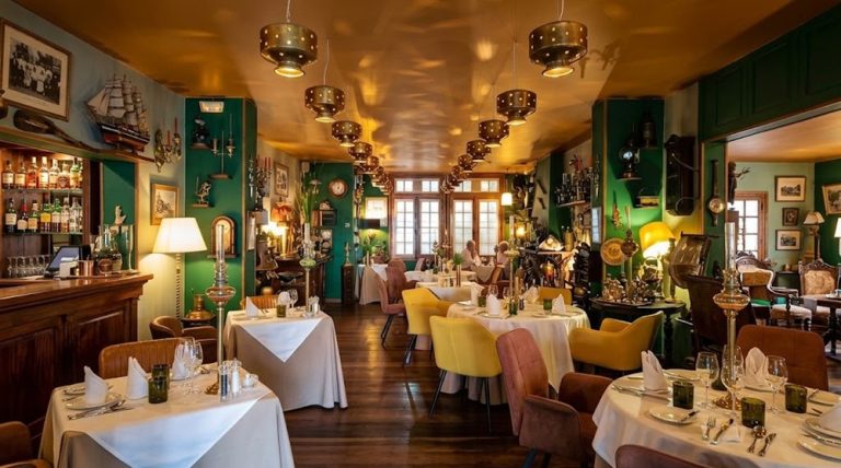 Elegant dining room inside La Varangue restaurant in Antananarivo, Madagascar