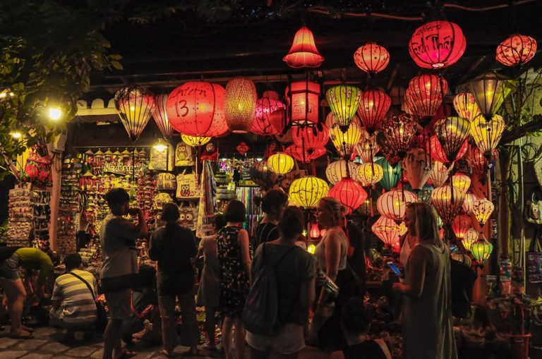 Colourful lanterns lighting up Hoi An Ancient Town, one of the most enchanting places to visit in Vietnam Caption Description