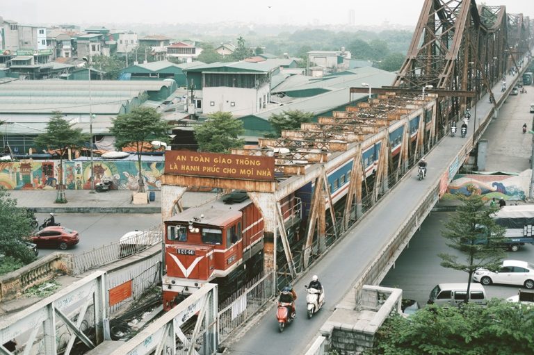 Train crossing Long Bien Bridge over the Red River in Hanoi Caption Description