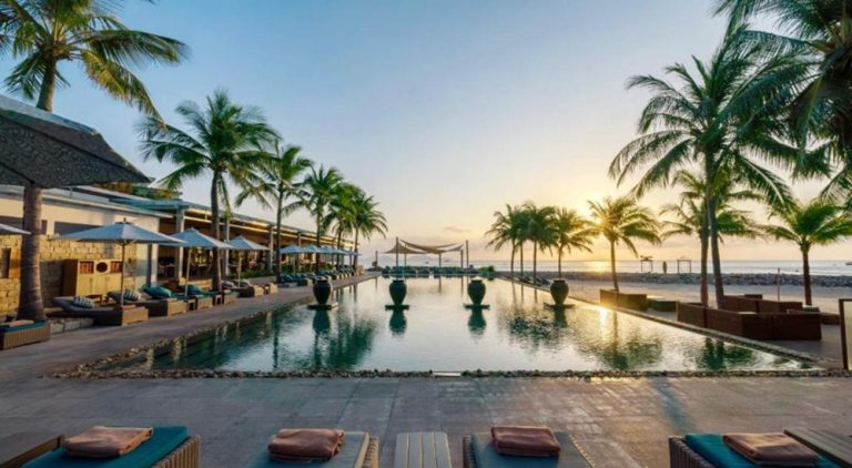 Infinity pool overlooking the beach at Mia Resort Nha Trang, a luxury beachfront resort on Vietnam's south-central coast