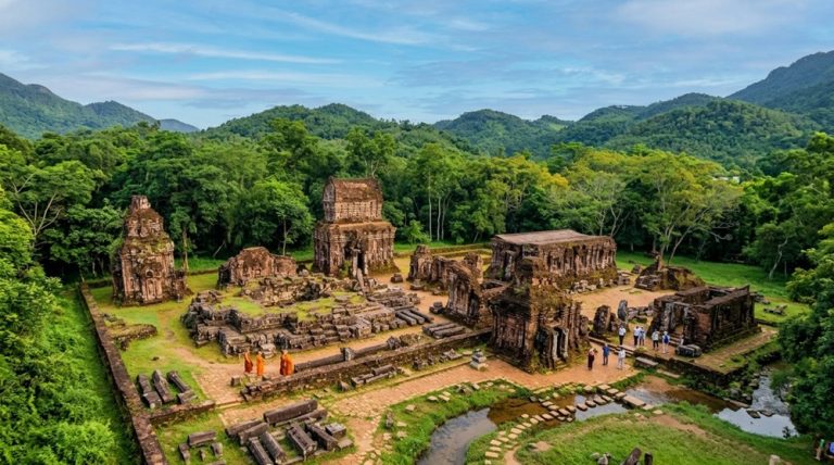 Ancient Cham temple ruins surrounded by forest and mountains at My Son Sanctuary in Vietnam