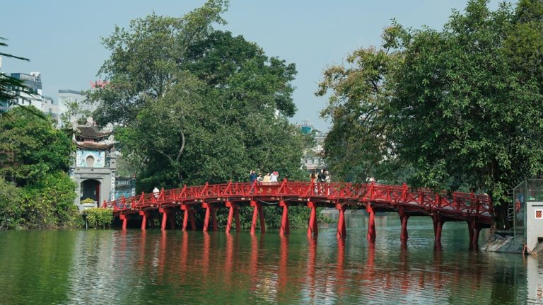 Red The Huc Bridge crossing Hoan Kiem Lake to Ngoc Son Temple in Hanoi