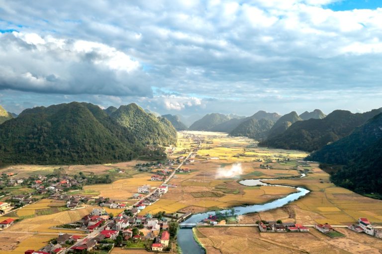 Panoramic view of limestone valleys and rice fields in Northern Vietnam during the best time to visit Vietnam